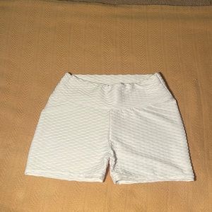 White biker shorts with textured pattern